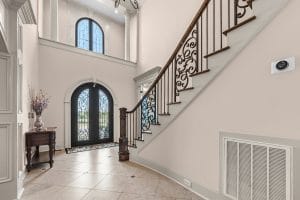 Two story foyer and staircase photographed for a Huntsville Alabama real estate listing