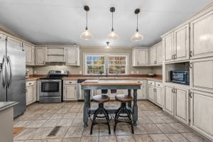 Kitchen with center island photographed by a Huntsville real estate photographer